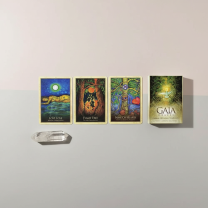 Four Gaia Oracle Cards are displayed in a clean horizontal spread with a small crystal, highlighting the artwork and design details. — for Carpe Diem Dream