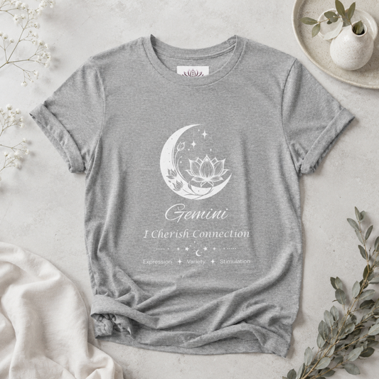 Gemini Moon I Cherish Connection zodiac T-shirt in Athletic Heather with white moon-inspired lotus, floral, and celestial artwork and Expression, Variety, Stimulation text, styled in a cool-toned studio botanical flat lay. — for Carpe Diem Dream