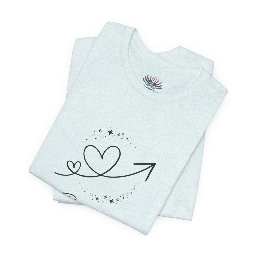 Gemini Rising I Engage zodiac T-shirt in Heather Ice Blue with black celestial heart and arrow artwork, shown folded in a supplier mockup. — for Carpe Diem Dream