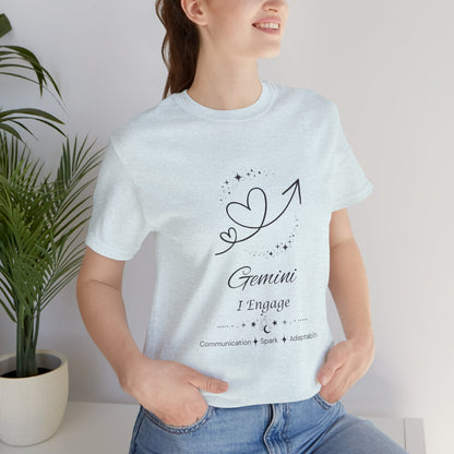 Model wearing a Heather Ice Blue Gemini Rising I Engage zodiac T-shirt with black celestial heart and arrow artwork. — for Carpe Diem Dream