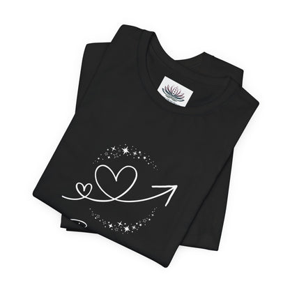Gemini Rising I Engage zodiac T-shirt in black with white celestial heart and arrow artwork, shown folded in a supplier mockup. — for Carpe Diem Dream