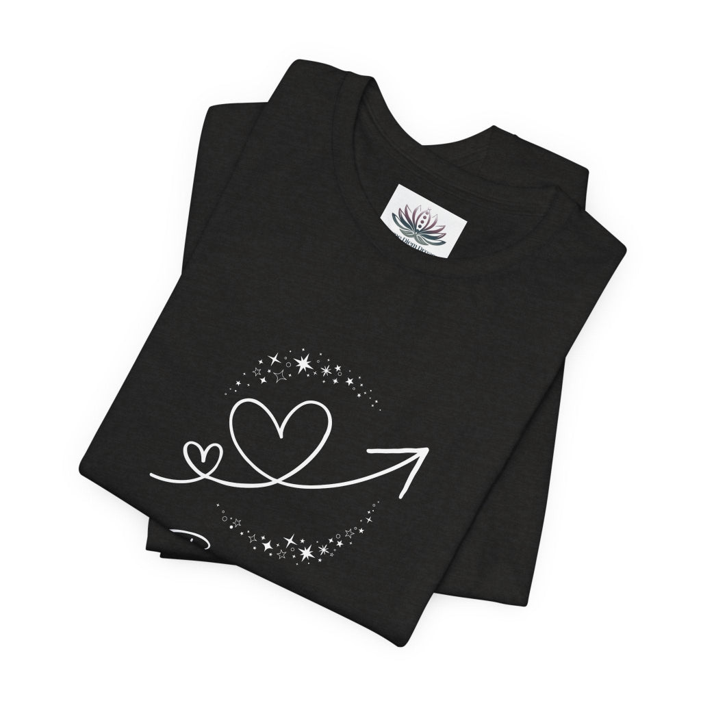 Gemini Rising I Engage zodiac T-shirt in Black Heather with white celestial heart and arrow artwork, shown folded in a supplier mockup. — for Carpe Diem Dream