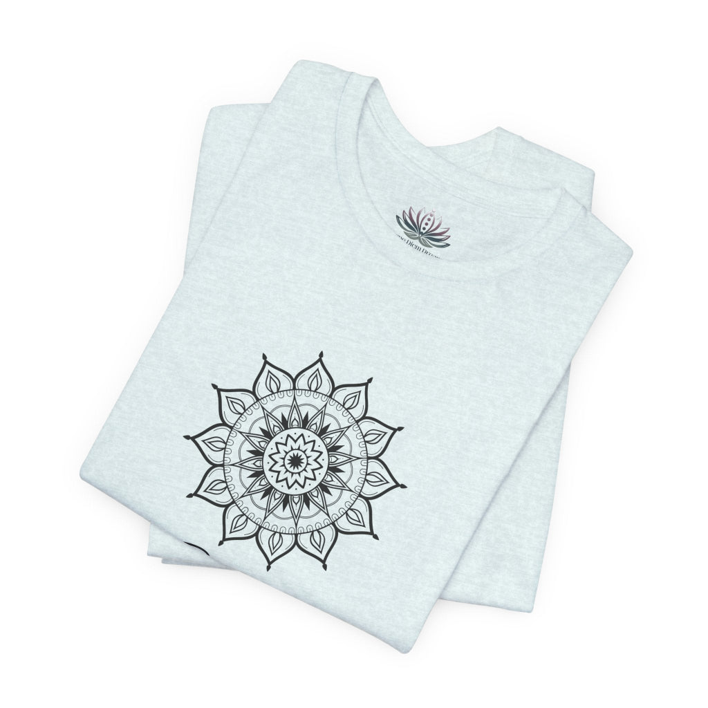 Gemini Sun I Think zodiac T-shirt in heather ice blue with black sun-inspired mandala artwork, shown folded with Carpe Diem Dream neck label in a supplier mockup. — for Carpe Diem Dream