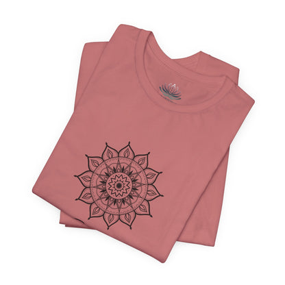 Gemini Sun I Think zodiac T-shirt in mauve with black sun-inspired mandala artwork, shown folded with Carpe Diem Dream neck label in a supplier mockup. — for Carpe Diem Dream