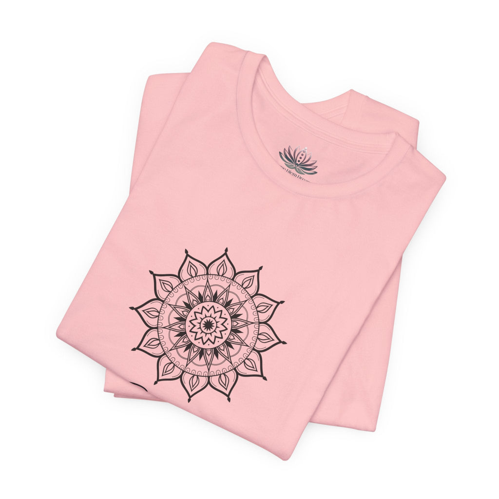 Gemini Sun I Think zodiac T-shirt in pink with black sun-inspired mandala artwork, shown folded with Carpe Diem Dream neck label in a supplier mockup. — for Carpe Diem Dream