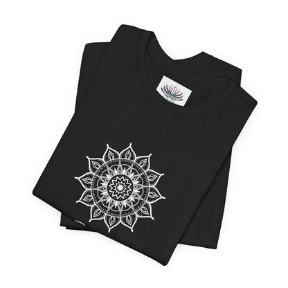 Gemini Sun I Think zodiac T-shirt in black with white sun-inspired mandala artwork, shown folded with Carpe Diem Dream neck label in a supplier mockup. — for Carpe Diem Dream
