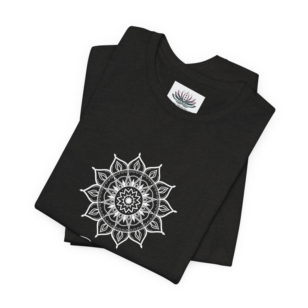 Gemini Sun I Think zodiac T-shirt in black heather with white sun-inspired mandala artwork, shown folded with Carpe Diem Dream neck label in a supplier mockup. — for Carpe Diem Dream