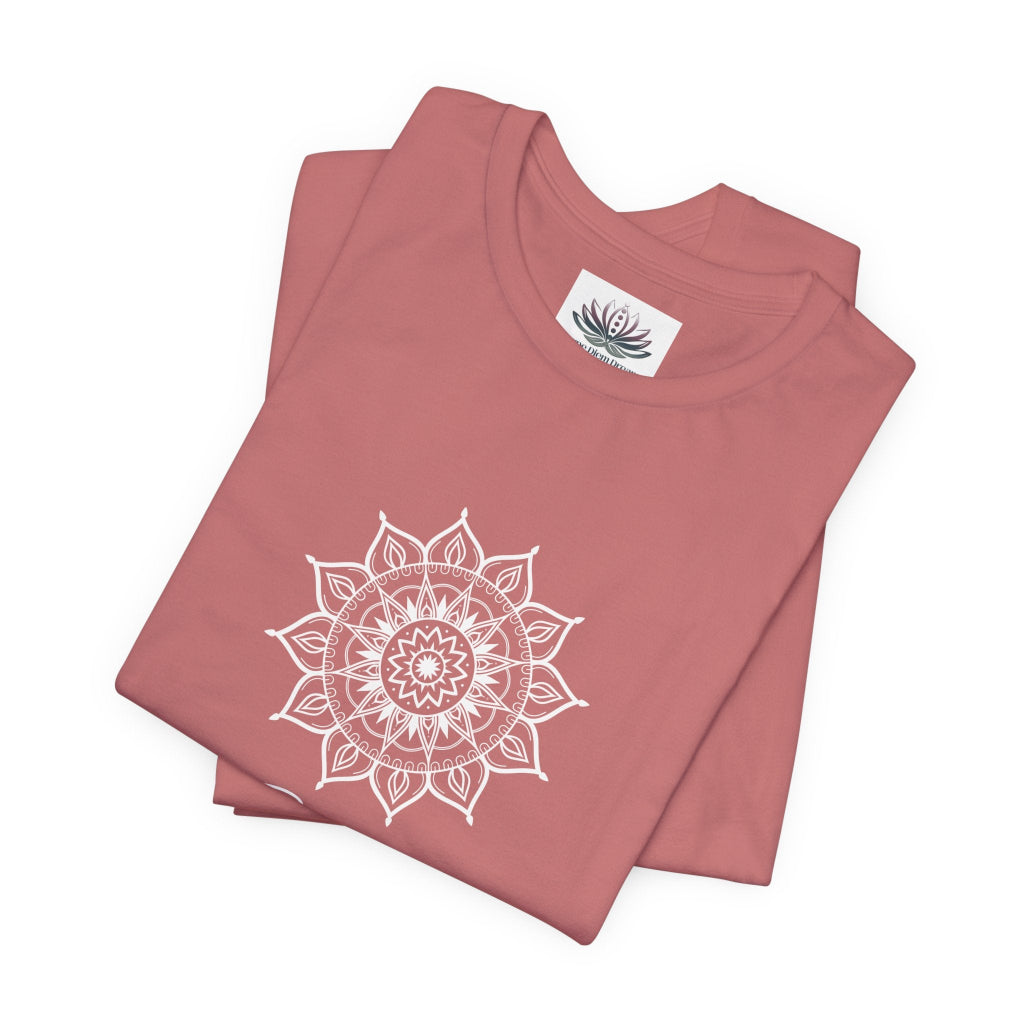 Gemini Sun I Think zodiac T-shirt in mauve with white sun-inspired mandala artwork, shown folded with Carpe Diem Dream neck label in a supplier mockup. — for Carpe Diem Dream