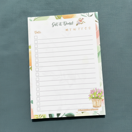 Floral-themed 4x6 checklist sticky notepad with “Get it Done” header displayed upright on a textured muted teal surface. — for Carpe Diem Dream