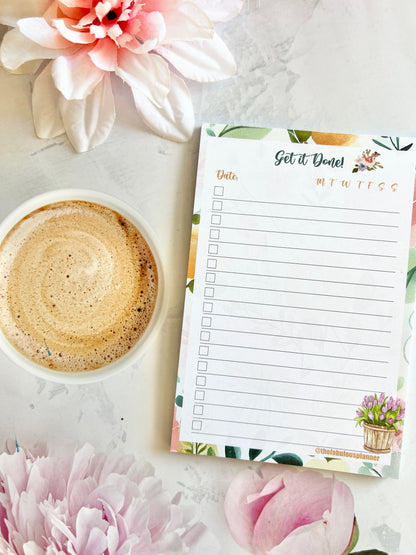 Checklist-style 4x6 sticky memo pad with floral accents and task layout displayed on a styled desk surface. — for Carpe Diem Dream
