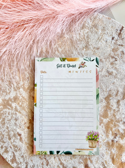 Floral-themed 4x6 checklist sticky notepad with “Get it Done” header displayed on a textured blush fabric surface. — for Carpe Diem Dream