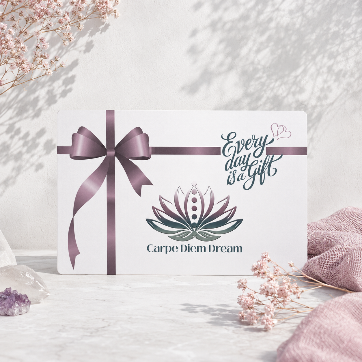 Carpe Diem Dream gift card styled with mauve ribbon, pale botanicals, crystals, and soft natural light. — for Carpe Diem Dream