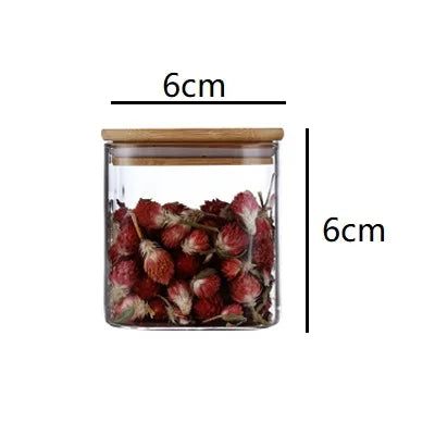 Set of small glass storage jars with bamboo lids shown with 6 cm height and width measurements on a white background. — for Carpe Diem Dream