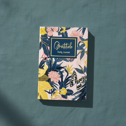 Front cover of Gratitude Daily Journal in glossy softcover format displayed upright on a teal textured background — for Carpe Diem Dream