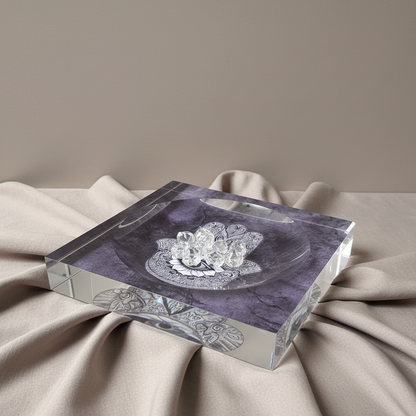 A square acrylic Hamsa catchall dish with a purple marbled design displayed on softly draped neutral fabric with clear crystals in gentle natural light. — for Carpe Diem Dream