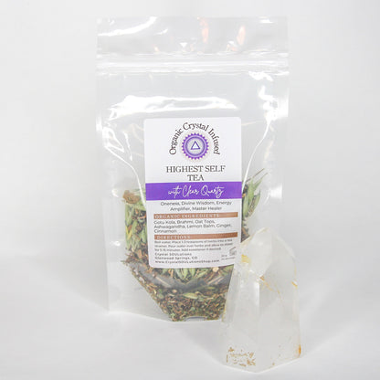 Highest Self Tea – Organic Crystal Infused 20g loose-leaf herbal tea with Clear Quartz crystal energy, displayed beside a polished Clear Quartz point with the herbal tea blend visible through the clear pouch on a clean white background. — for Carpe Diem Dream