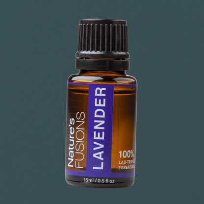 Close-up of a 15ml amber glass bottle of Lavender essential oil with a black cap and purple label against a muted teal background. — for Carpe Diem Dream
