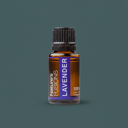 A 15ml amber glass bottle of Lavender essential oil with a black cap and purple label displayed against a muted teal background. — for Carpe Diem Dream