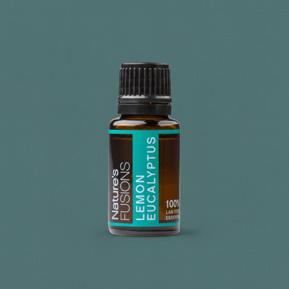 A 15ml amber glass bottle of Lemon Eucalyptus essential oil with a black cap and teal label displayed against a muted teal background. — for Carpe Diem Dream