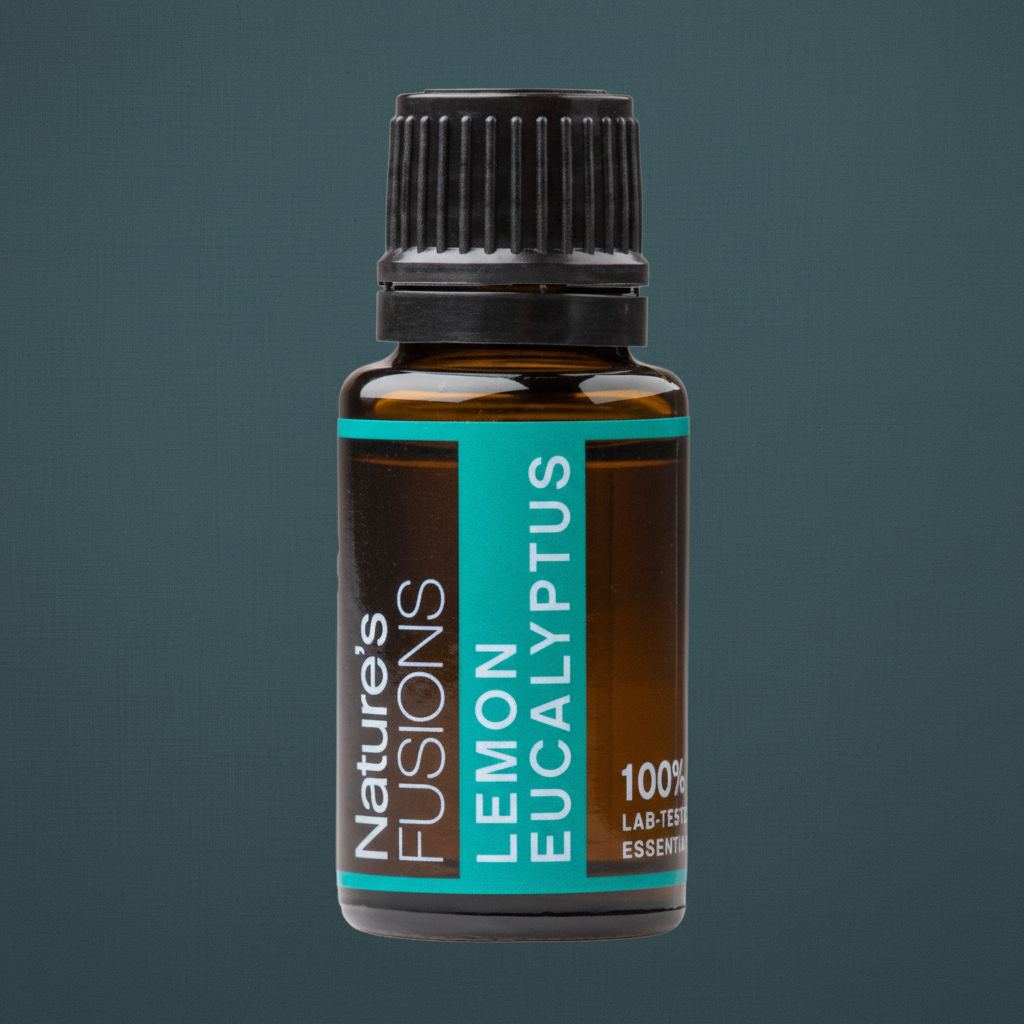Close-up detail of a 15ml amber glass bottle of Lemon Eucalyptus essential oil showing the black cap and teal label against a muted teal background. — for Carpe Diem Dream