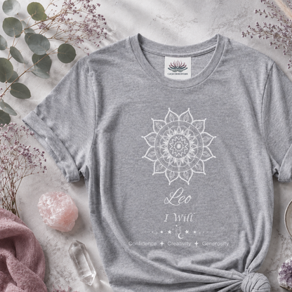 Leo Sun I Will zodiac t-shirt in athletic heather with white sun-inspired mandala artwork and Confidence, Creativity, Generosity text, styled in a cool-toned studio botanical flat lay. — for Carpe Diem Dream