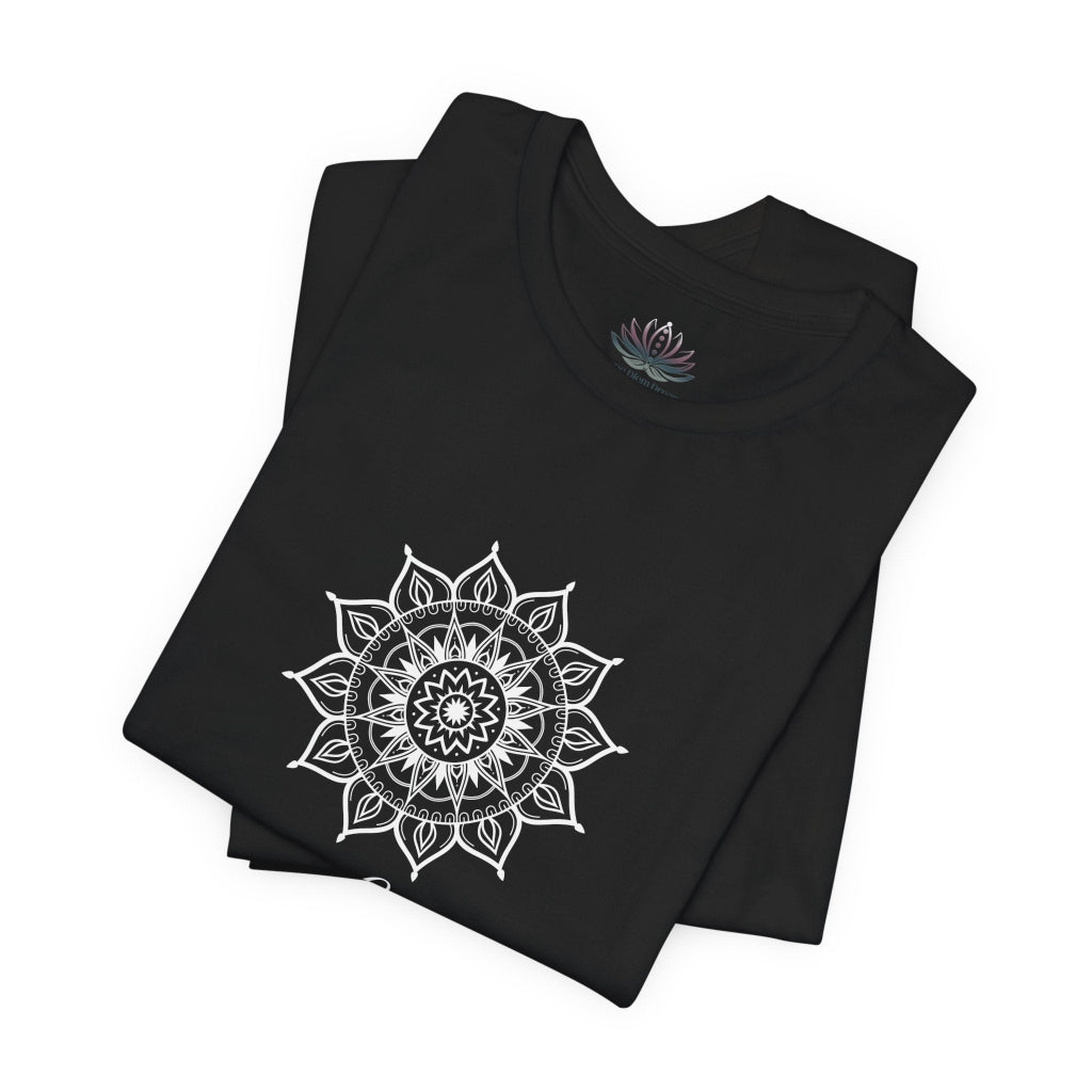 Leo Sun I Will zodiac t-shirt in black with white sun-inspired mandala artwork and Confidence, Creativity, Generosity text, shown folded in a supplier mockup. — for Carpe Diem Dream