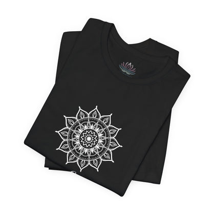 Leo Sun I Will zodiac t-shirt in black with white sun-inspired mandala artwork and Confidence, Creativity, Generosity text, shown folded in a supplier mockup. — for Carpe Diem Dream