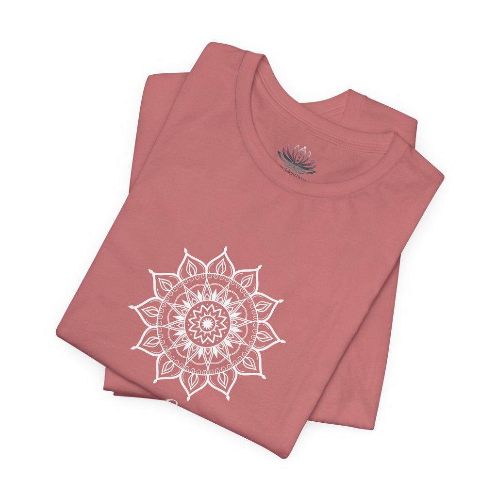 Leo Sun I Will zodiac T-shirt in mauve with white sun-inspired mandala artwork, shown folded with Carpe Diem Dream neck label in a supplier mockup. — for Carpe Diem Dream