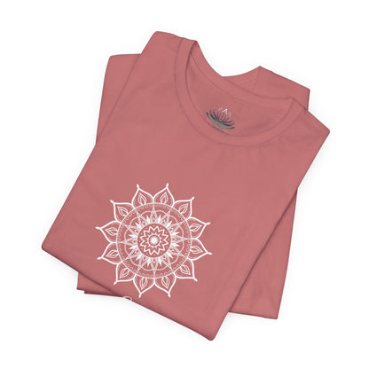Leo Sun I Will zodiac T-shirt in mauve with white sun-inspired mandala artwork, shown folded with Carpe Diem Dream neck label in a supplier mockup. — for Carpe Diem Dream