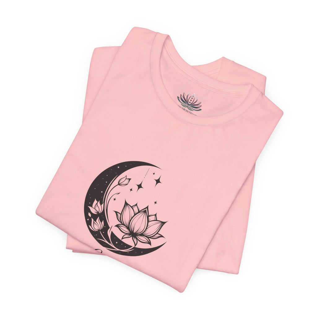 Libra Moon I Cherish Harmony zodiac T-shirt in pink with black moon-inspired lotus, floral, and celestial artwork, shown folded in a supplier mockup. — for Carpe Diem Dream