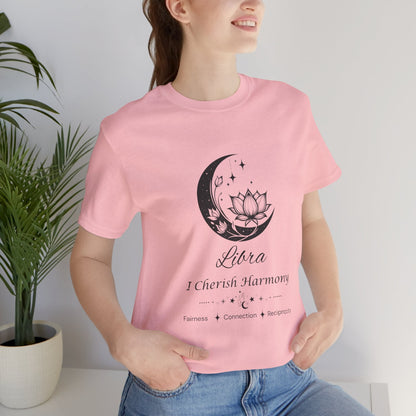 Model wearing a pink Libra Moon I Cherish Harmony zodiac T-shirt with black moon-inspired lotus, floral, and celestial artwork. — for Carpe Diem Dream