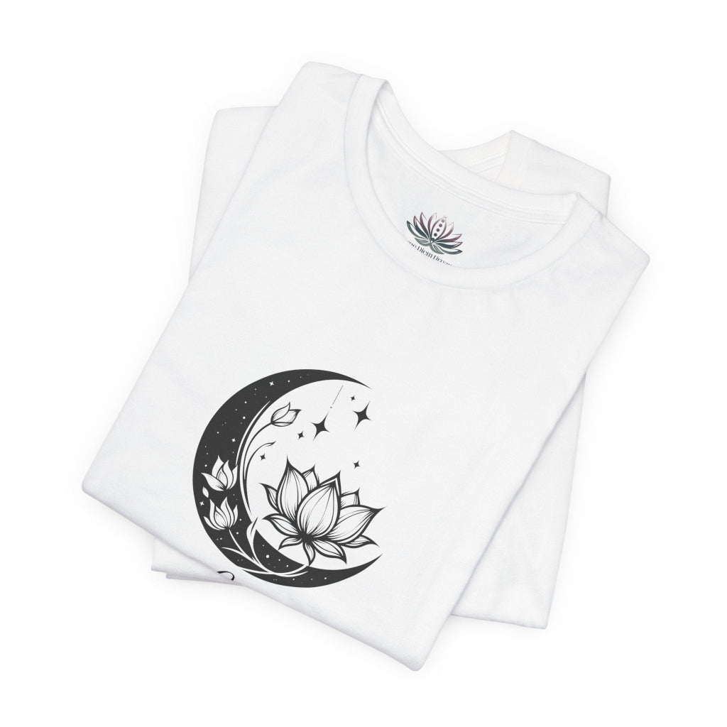 Libra Moon I Cherish Harmony zodiac T-shirt in white with black moon-inspired lotus, floral, and celestial artwork, shown folded in a supplier mockup. — for Carpe Diem Dream