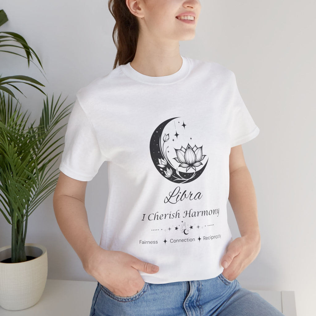 Model wearing a white Libra Moon I Cherish Harmony zodiac T-shirt with black moon-inspired lotus, floral, and celestial artwork. — for Carpe Diem Dream