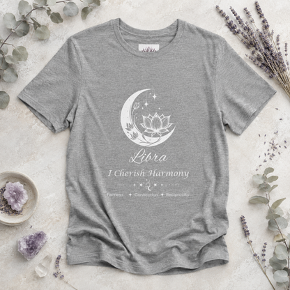 Libra Moon I Cherish Harmony zodiac T-shirt in Athletic Heather with white moon-inspired lotus, floral, and celestial artwork and Fairness, Connection, Reciprocity text, styled in a cool-toned studio botanical flat lay. — for Carpe Diem Dream