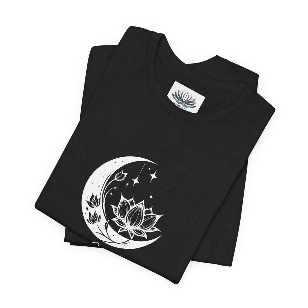 Libra Moon I Cherish Harmony zodiac T-shirt in Black Heather with white moon-inspired lotus, floral, and celestial artwork, shown folded in a supplier mockup. — for Carpe Diem Dream