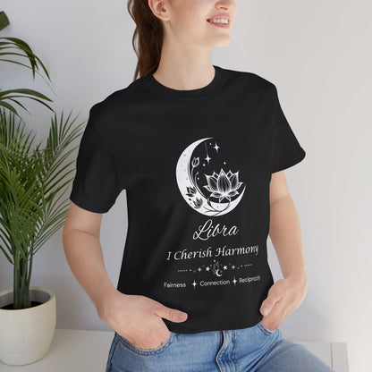 Model wearing a black Libra Moon I Cherish Harmony zodiac T-shirt with white moon-inspired lotus, floral, and celestial artwork. — for Carpe Diem Dream
