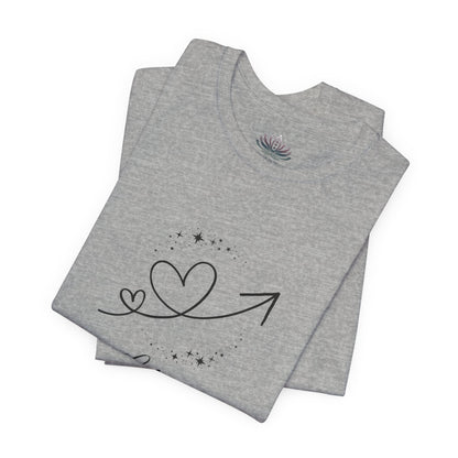 Libra Rising I Connect zodiac T-shirt in Athletic Heather with black celestial heart and arrow artwork, shown folded in a supplier mockup. — for Carpe Diem Dream