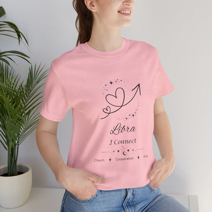 Model wearing a pink Libra Rising I Connect zodiac T-shirt with black celestial heart and arrow artwork. — for Carpe Diem Dream