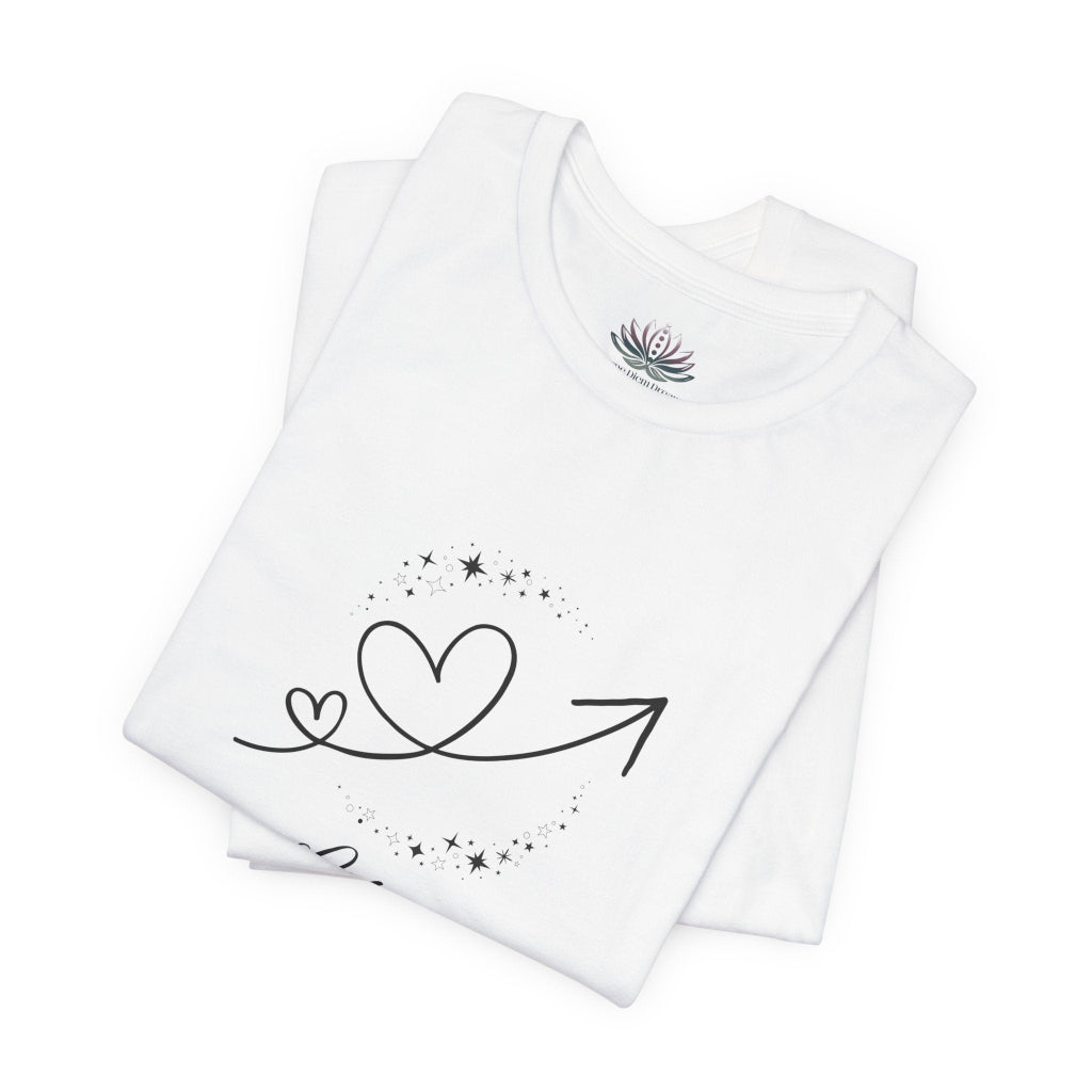 Libra Rising I Connect zodiac T-shirt in white with black celestial heart and arrow artwork, shown folded in a supplier mockup. — for Carpe Diem Dream