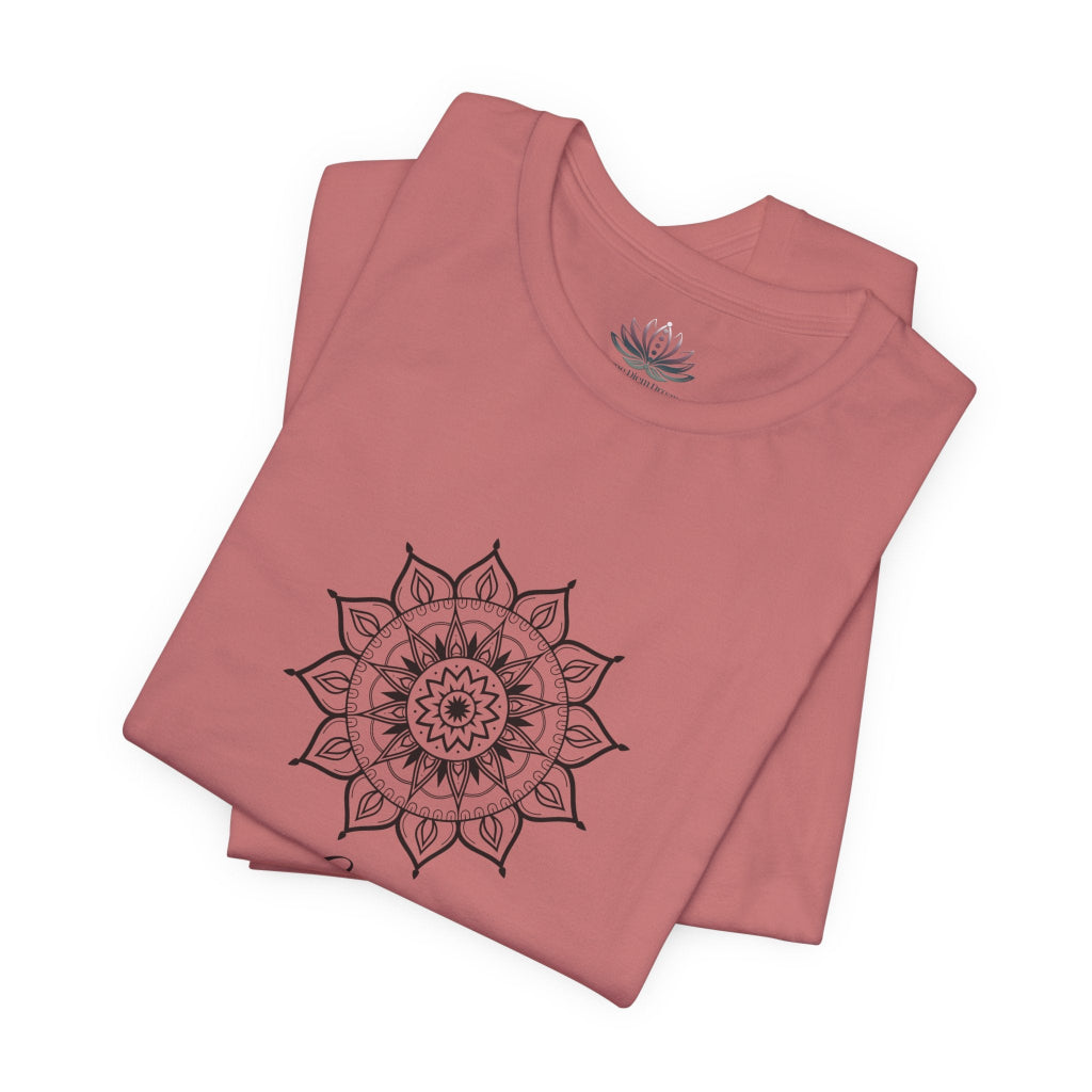 Libra Sun I Balance zodiac T-shirt in mauve with black sun-inspired mandala artwork, shown folded with Carpe Diem Dream neck label in a supplier mockup. — for Carpe Diem Dream