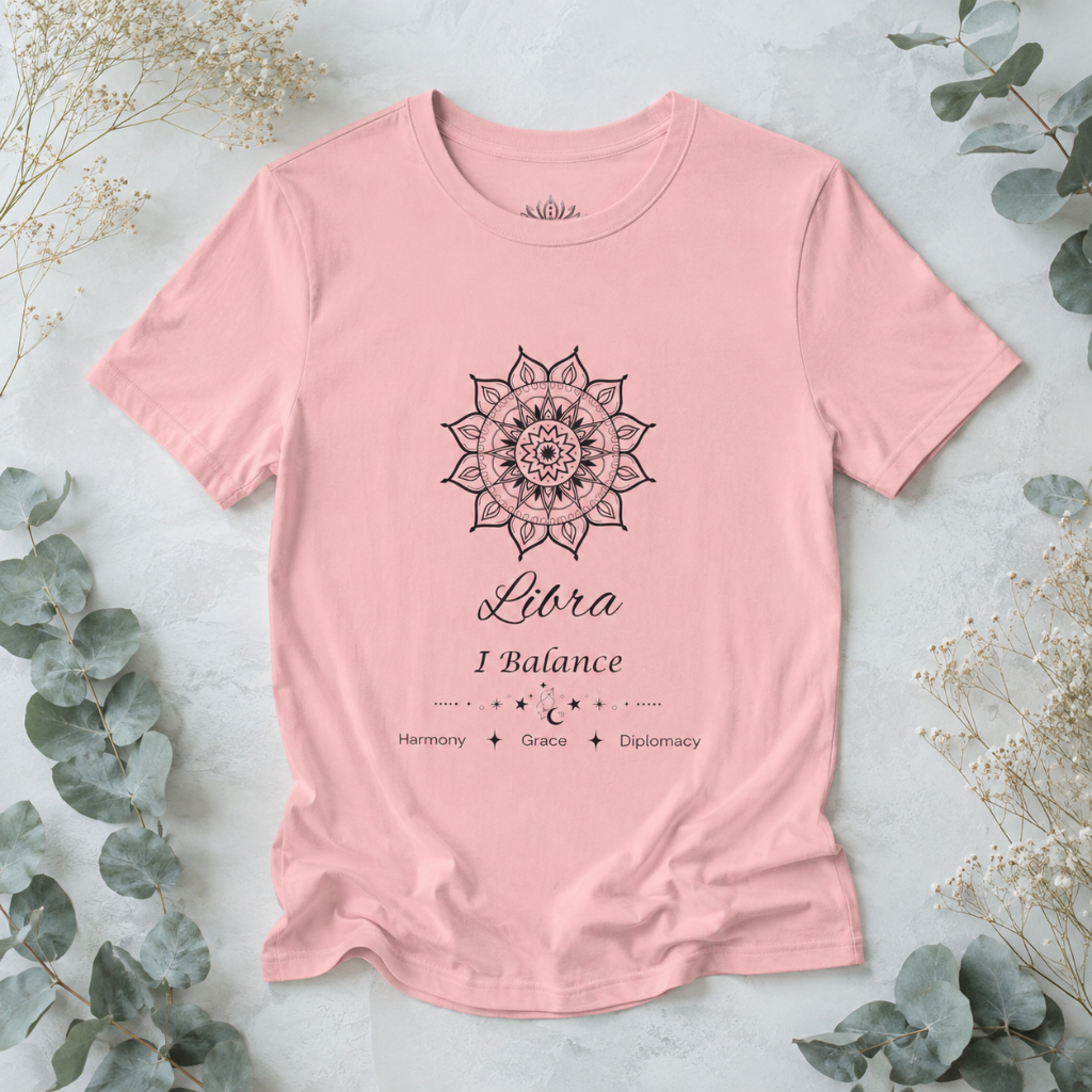 Libra Sun I Balance zodiac T-shirt in pink with black sun-inspired mandala artwork and Harmony, Grace, Diplomacy text, styled in a cool-toned studio botanical flat lay. — for Carpe Diem Dream