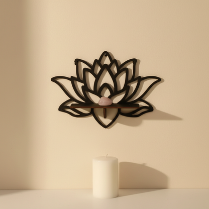A lotus-shaped floating wall shelf mounted on a neutral wall holding a crystal with a candle placed below on a clean surface. — for Carpe Diem Dream