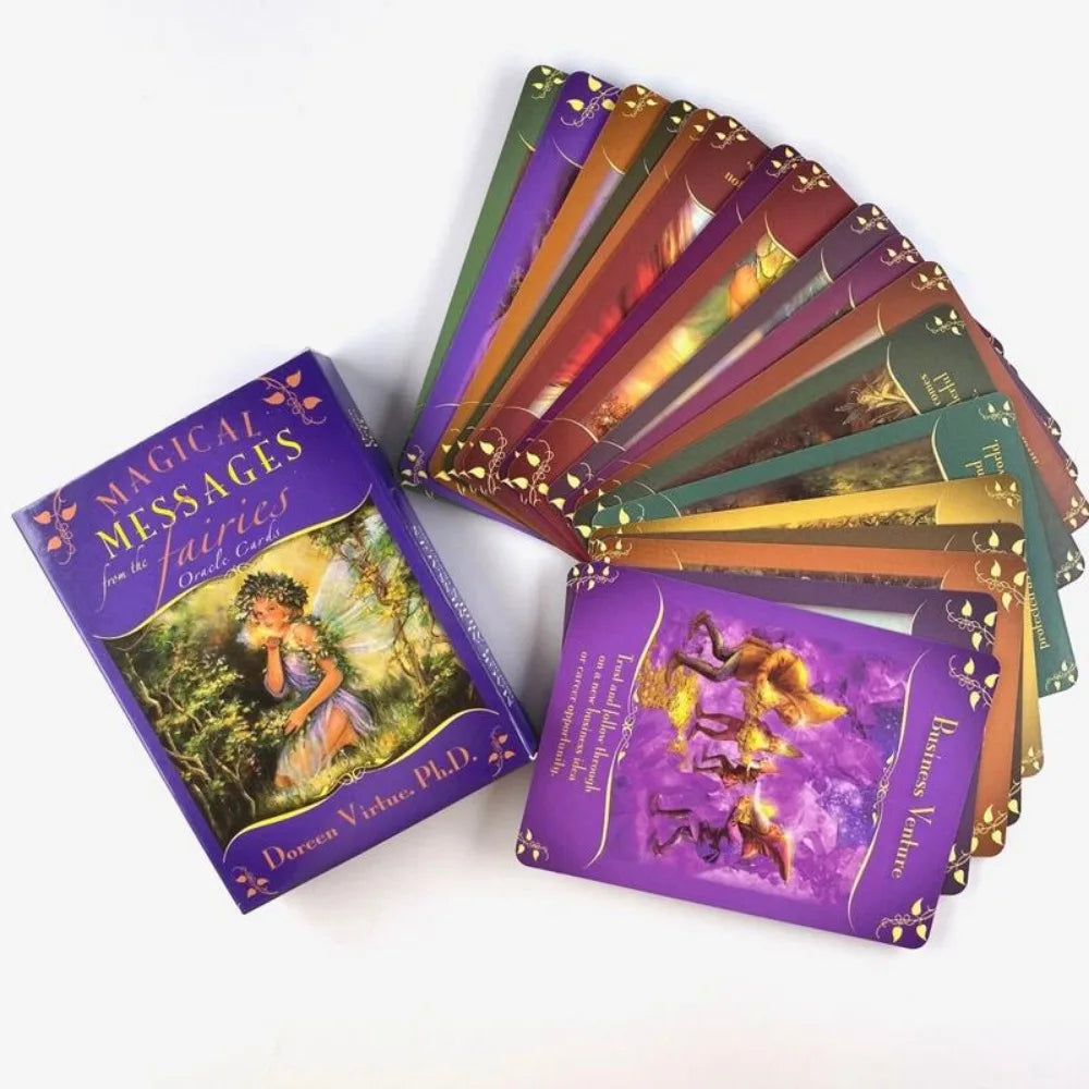 Magical Messages From The Fairies Oracle deck fanned out beside the box, showing colorful illustrated cards on a white background. — for Carpe Diem Dream