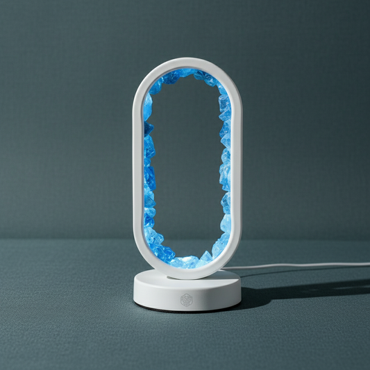 Manifest Success – Clear Quartz Lamp of Achievement with Aura Plating & Remote Light Modes standing upright on a matte teal textured surface, softly illuminated with natural diffused lighting — for Carpe Diem Dream.
