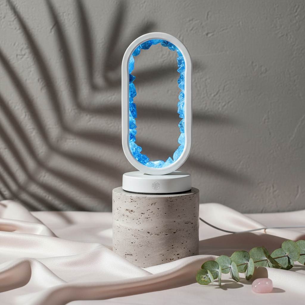 Clear Quartz Lamp displayed on gray travertine cylinders over blush silk fabric with soft daylight shadows, symbolizing clarity and manifestation — styled by Carpe Diem Dream.