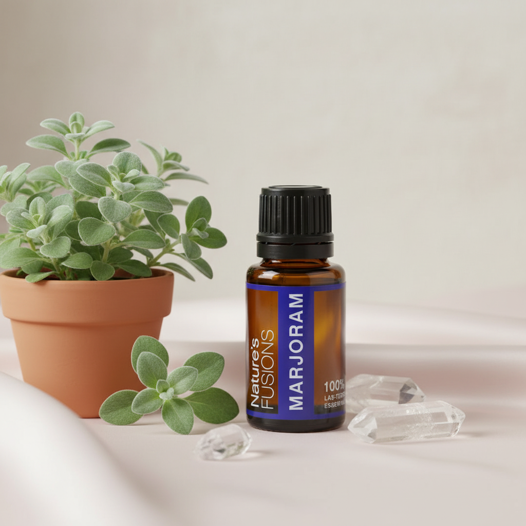 Amber glass bottle of Marjoram Essential Oil styled beside fresh green marjoram leaves and clear crystal stones on a neutral surface in soft natural light. — for Carpe Diem Dream