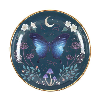 Midnight Moth Celestial Trinket Dish featuring a blue night sky design with a moth, moon, and floral details accented in gold, styled for Carpe Diem Dream.