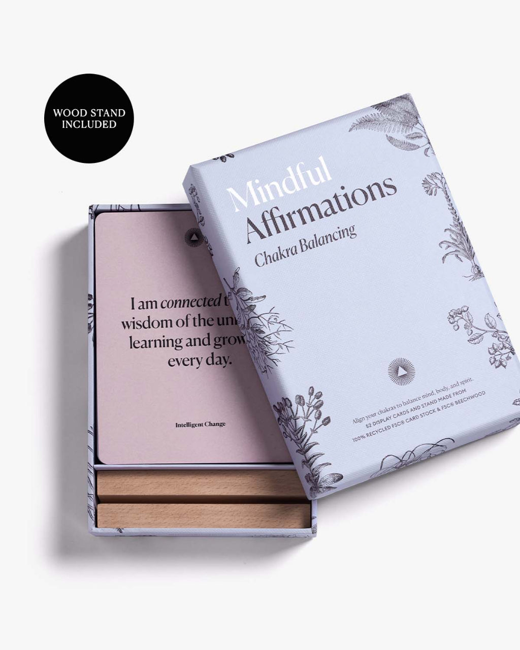 Mindful Affirmations for Chakra Balancing card deck with the affirmation box open to reveal an affirmation card and wooden display stand on a clean white background. — for Carpe Diem Dream