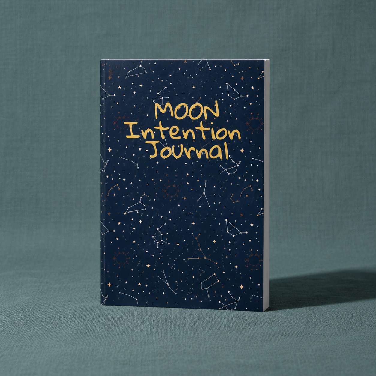 Moon Intention Journal displayed upright featuring celestial artwork and constellation details for intention setting, moon rituals, and manifestation journaling. — for Carpe Diem Dream.