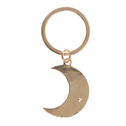 Back view of the Moon Phase Celestial Keychain featuring a smooth gold-tone crescent moon charm and keyring on a white background, styled for Carpe Diem Dream.